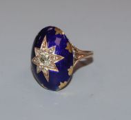 A 19th century yellow metal and diamond set blue enamel oval ring, with central star motif, size O.