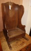 An 18th century oak child's rocking chair H.61cm