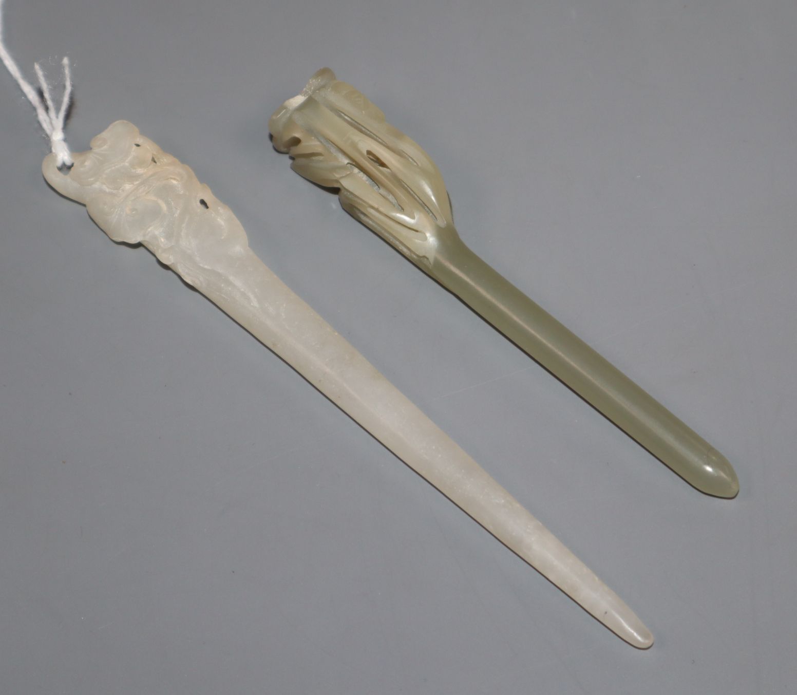 A Chinese white jade hairpin and a celadon jade hairpin