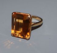 An 18ct and citrine set dress ring, size J.