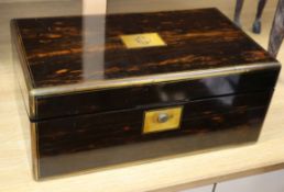 A Victorian coromandel and brass mounted writing slope, with hidden compartment and keys, with