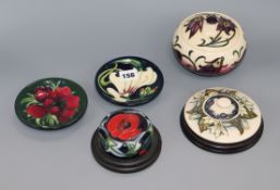 Two Moorcroft paperweights, jar and cover and two dishes