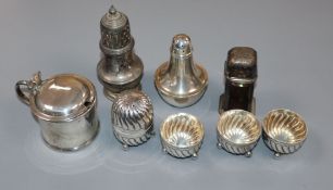 A Victorian matched four piece silver fluted condiment set and four other silver condiments