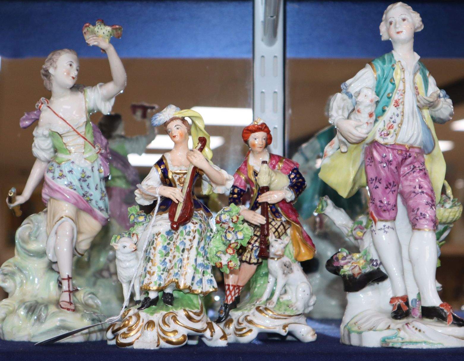 Four Derby porcelain groups, c.1765-1775, including a pair of musicians, incised mark 'No. 301', the