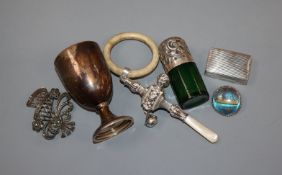 A quantity of mixed silver to include an egg cup, rattle, snuff box, salts bottle, etc.