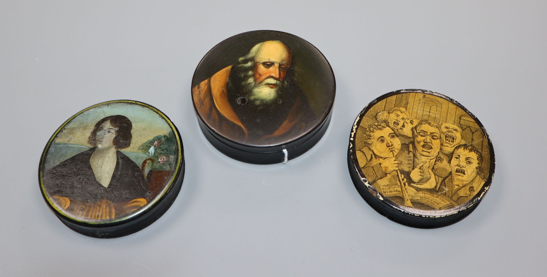 A Stobwasser circular papier mache box and two others, similar