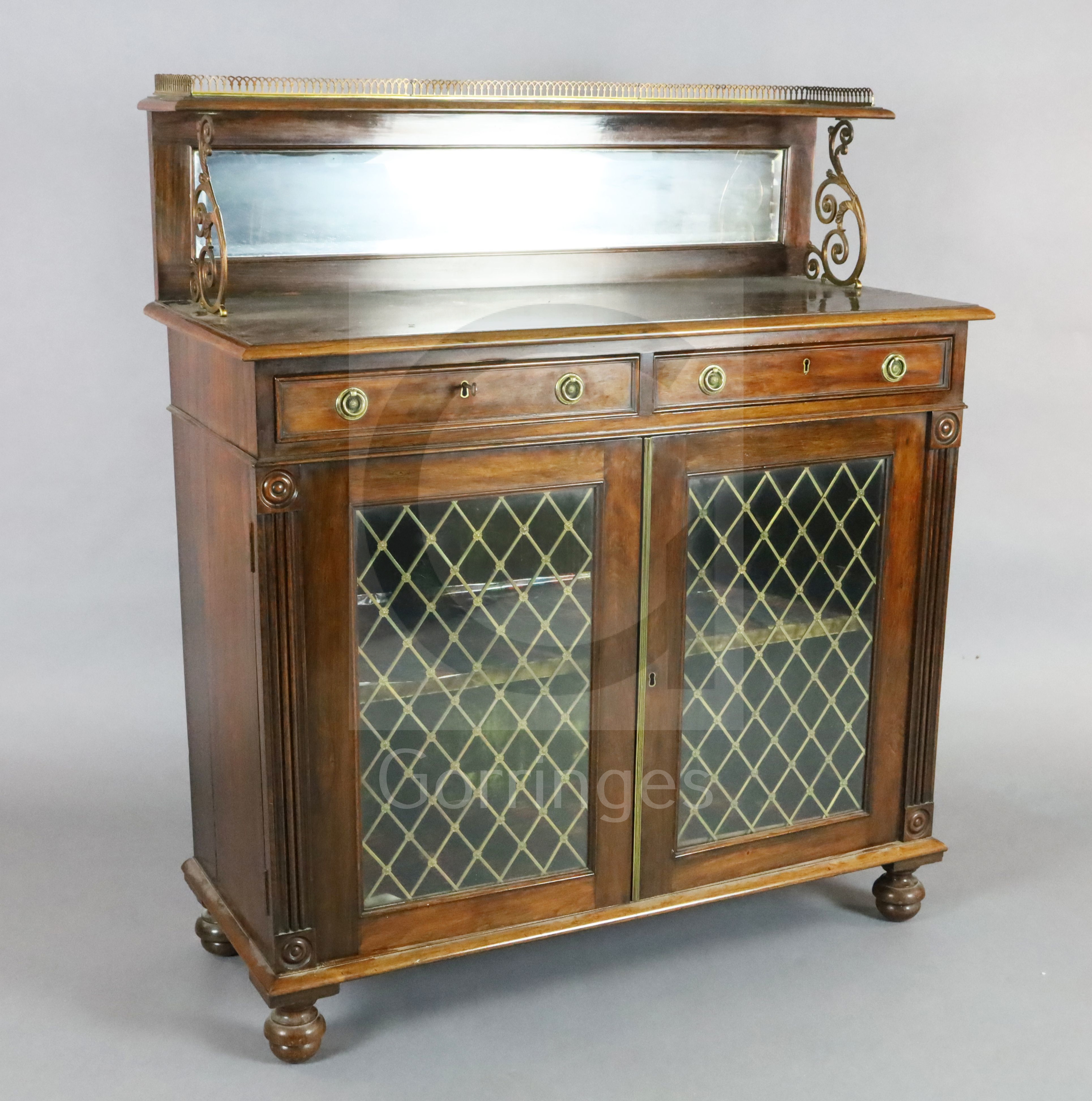 A William IV brass mounted rosewood chiffonier, with three quarter gallery, mirrored back, two