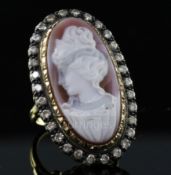 An 18ct gold, sardonyx hardstone cameo and diamond set oval dress ring, the stone carved with the