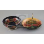 A Moorcroft 'pomegranate' and Tudric pewter mounted bowl and an 'Eventide' cake dish, c.1920-5,