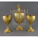 A George III silver gilt two handled presentation pedestal cup and cover by Soloman Hougham and a