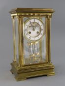 An early 20th century French ormolu four glass mantel clock, with enamelled Roman dial, visible