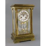 An early 20th century French ormolu four glass mantel clock, with enamelled Roman dial, visible