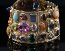 A 20th century Middle Eastern gold and multi-gem set bracelet, the stones of varying cuts and