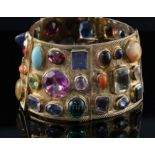 A 20th century Middle Eastern gold and multi-gem set bracelet, the stones of varying cuts and