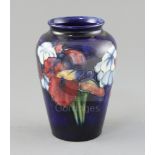 A Moorcroft 'orchid' ovoid vase, 1950's, impressed Moorcroft Made in England, inscribed in blue