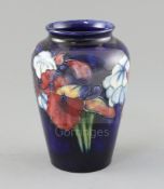 A Moorcroft 'orchid' ovoid vase, 1950's, impressed Moorcroft Made in England, inscribed in blue