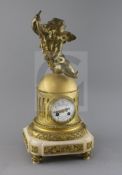 A late 19th century French ormolu mantel clock, surmounted with a figure of Cupid holding grapes,