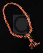 A late 19th/early 20th century gold mounted carved coral choker necklace with clasp set with coral