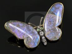 An early 20th century 15ct gold, garnet, diamond and butterfly wing set butterfly brooch, engraved