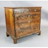 A George III featherbanded walnut chest of two short and three graduated long drawers, on bracket