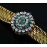 A lady's 18ct gold Jaeger Le Coultre 18ct gold, emerald and diamond set cocktail bracelet watch, the