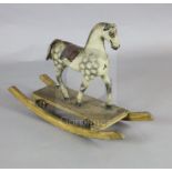 A rare Victorian carved and painted wood dapple grey rocking horse, of small proportions, with