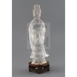 A Chinese rock crystal figure of Guanyin, late 19th century, standing and holding a basket, H.