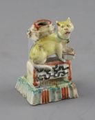 A Chinese enamelled porcelain 'cat' joss-stick holder, 18th century, H. 7cmEx. John Hilliard