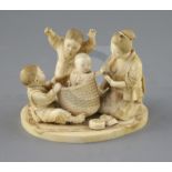A good Japanese ivory okimono of a lady and children playing, Meiji period, with two boys scaring