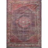 An antique Malayer carpet, dated 1905, with central medallion in a field of geometric motifs and