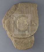 A carved limestone heraldic shield, pre-1500, with quartered armorial and inscription below 'God