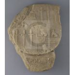 A carved limestone heraldic shield, pre-1500, with quartered armorial and inscription below 'God