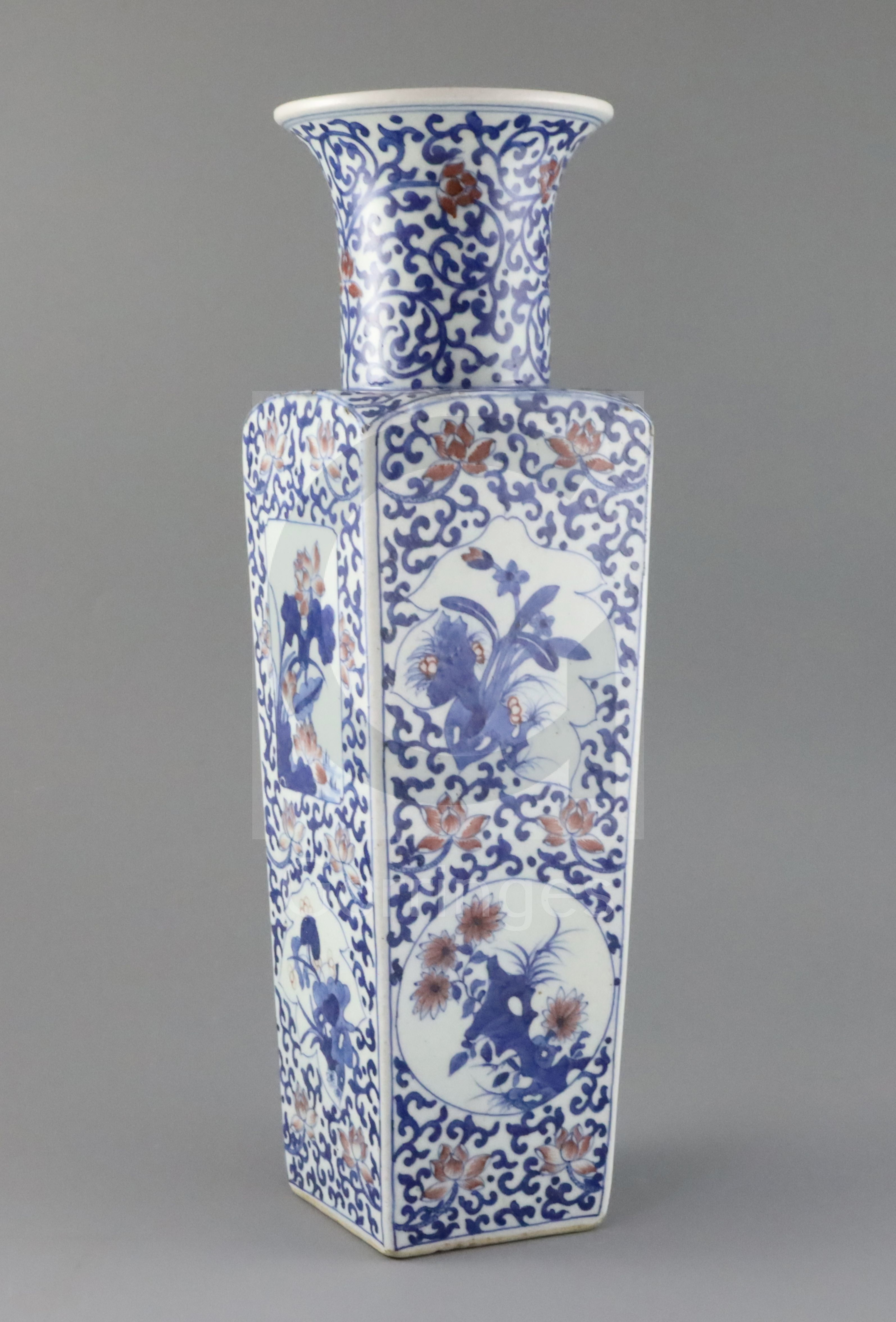 A Chinese underglaze blue and copper red square baluster vase, late Qing dynasty, painted with