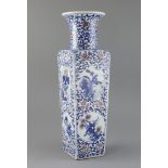 A Chinese underglaze blue and copper red square baluster vase, late Qing dynasty, painted with