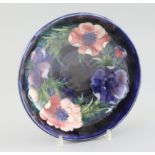 A Moorcroft 'anemone' cobalt blue ground bowl, c.1950, impressed mark Moorcroft Made in England,