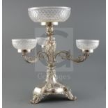 A late Victorian Walker & Hall silver plated centrepiece, the central cut glass bowl raised on a