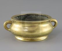 A good Chinese polished bronze censer, gui, 17th/18th century, applied with a pair of lug handles,