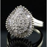 A modern 18ct white gold and diamond pear shaped cluster dress ring, set with round and baguette cut