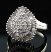 A modern 18ct white gold and diamond pear shaped cluster dress ring, set with round and baguette cut