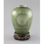 A Chinese green Jun-type vase, 19th century, with a fine crackle to the glaze, H. 17cm, wood stand