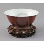 A Chinese copper red glazed bowl, Qianlong seal mark and of the period (1736-95), D. 18.2cm, small