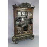 A Japanese Meiji period carved wood and shibayama cabinet, with phoenix crest, an arrangement of