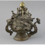 A Tibetan bronze hanging censer, 19th century, modelled and pierced with dragons and phoenixes and