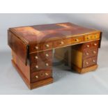 A Victorian mahogany twin-pedestal partner's desk, fitted red leather skiver over three frieze