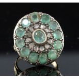 A 19th century style gold, emerald and rose cut diamond set target cluster dress ring, with carved