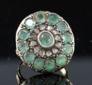 A 19th century style gold, emerald and rose cut diamond set target cluster dress ring, with carved