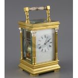 An early 20th century French gilt brass quarter-repeating carriage clock, striking on two gongs,