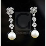 A pair of mid 20th century white metal, cultured pearl and diamond cluster set drop earrings, 33mm.