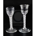 Two double series opaque twist stem cordial glasses, c.1760, each with a fluted bowl and conical