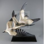 Alexandre Kelety (1918-1940). An Art Deco silvered bronzed group of three seagulls swooping over a